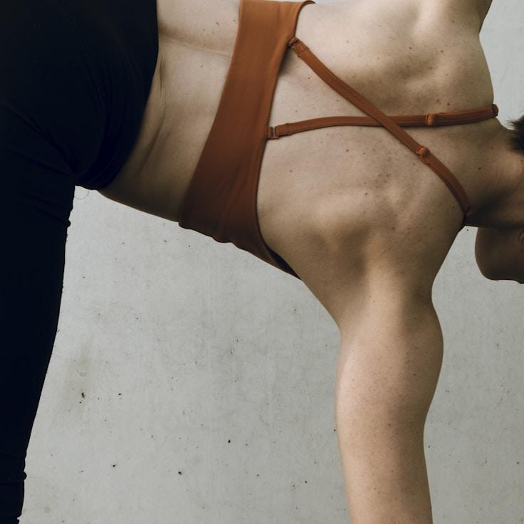 Women in a fitness class doing stretching and mobility exercises